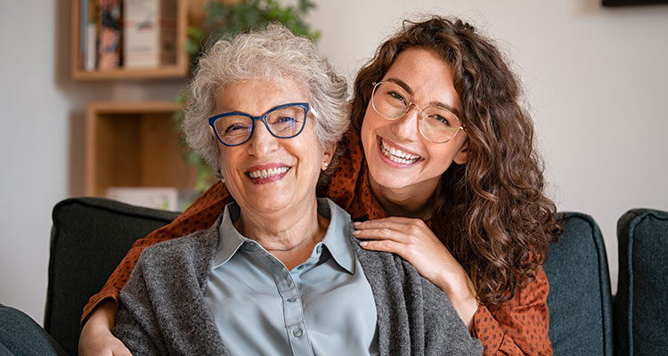 Happy elderly woman and her daughter